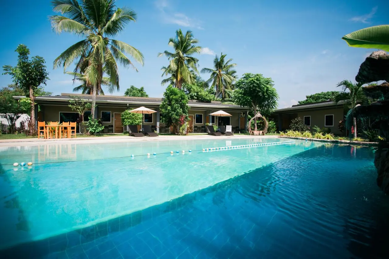 Hidden Lagoon Resort — lagoon pool palms
